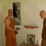 Shrine building in the Bhikkhu vihara. Ajahn Medhino leads the way.