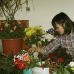 Tara carefully selecting flowers.