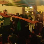 The monastery committee carry the robe cloth as a collective offering to the sangha.