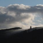 The early morning sky flows over the hill tops.
