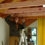 Ajahn Kusalo working on the new false ceiling in the Bhikkhu vihara common room.<br />