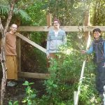 Venerable Aruno George and Hannah almost ready to pour concrete around the posts of the privacy screen at the Chao Khun kuti.
