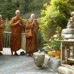 The sangha chants auspicious verses to bless the new buddha rupa.