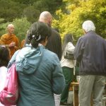 Everyone pours a little water on the new rupa to offer their blessing.