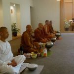 The Sangha silently reflecting at meal time.