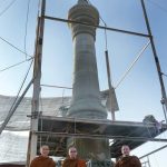 The pillar being erected on the site of Ajahn Chahs birth. Thats one single piece of stone.