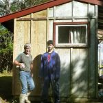Alan and Alex getting ready to paint the remodeled #1 kuti. The recycled ply on the unkinked corner can be seen on the left. New glass in the windows.