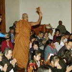 Ajahn Nantawat showers holy water blessings.
