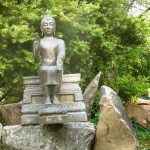 The Buddha patiently waits outside the dana sala - both to be polished and to have a finished stone plinth to sit on.