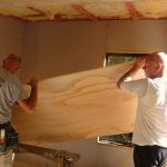 John and Chris maneuvering a ceiling panel into place. Only just enough room.