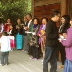 A small part of the group lined up on Sunday to offer rice to the Sangha.
