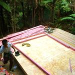 The new lower kuti about to get walls. Clare and Justine help to set out the frames.