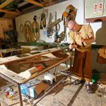 Ajahn Kusalo shaping the support posts for the board bearing the plaques to commemorate those who supported the construction of the kitchen.