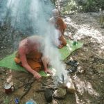 We are next to a small stream and tea is being prepared. Starting a fire with no paper or accelerant is a smoky affair.