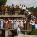 After the meal offering our kind donors posed for a photo on the canal sluice gate.