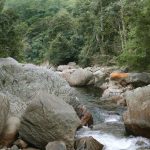 We meet the monks at the Aranya and then drop down the valley to the river for a bath. That's venerable Sumangala - center. Those rocks are big.