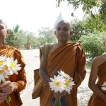 And here we are - the flower children - out to make offerings at the stupa.