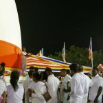 Following the drummers a flag is unwound and wrapped around the stupa. This took place many times during the evening.