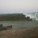 One single rock forms a dramatic barrier to the waves to offer another sheltered bathing pool.