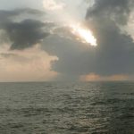 A hour after sunrise and two local fishermen come out to set their net.