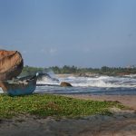 The fishermen's boat - and the surf they have to navigate to get out fishing. Kirinda temple - center right.