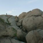 The rocks are big - the monk is small.