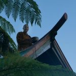 Ajahn Kusalo repairing his kuti stove chimney.