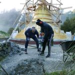 Craig and Felix hard at work breaking up the concrete slab where the reclining buddha rupa will go.