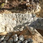 The patio stone wall at Ajahns kuti slowly progresses.