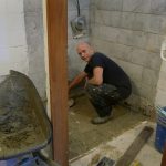 Bruce working wonders in the downstairs bhikkhu vihara bathroom.