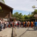 The weather is beautiful and the full extent of the courtyard can be used for pindapat.