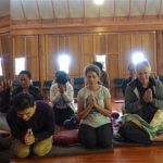 Ajahn Thitasippo gives a liberal liquid blessing to the new year retreatants.