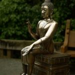 The buddha rupa (that sits outside the dana sala) shining with the loving care given by kathina visitors.