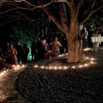 New years eve - just before midnight and the retreatants plant their aspirations under the wishing tree.