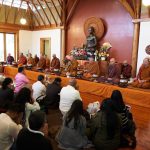 The Sangha is assembled and Kathina proceedings begin.