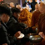 The sangha goes on rice pindapat.