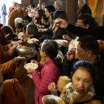 The sangha go on rice pindapat.