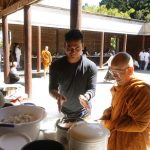 Food on three sides of the cloister being offered to the sangha.