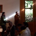 Ajahn Pum sprinkles a Vesak blessing.