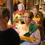 Robes and requisites are carried in cirucumambulation around the sala prior to being offered to the assembled sangha.