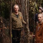 Forest persons clearing a track between the new kuti and kuti