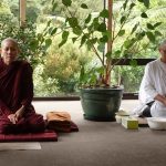 Ayya Abhisamma and Mae Chee Nuk quietly waiting in the dana sala for the meal time bell.