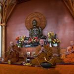 The Sangha chant parittas.
