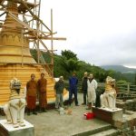 The first coat of paint on the stupa base. Not the best weather - but good enough.