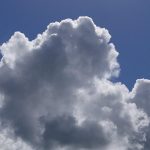 A winter cloud against a bright spring sky.