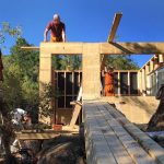 The roof timbers are ready and waiting. The sun is shining.