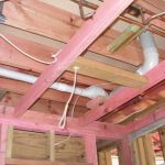 The upper floor kitchen toilet and bathroom pipe work tucks into the floor framing.