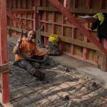 Bruce cleaning out the basement slab ready for concrete.