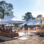 The tents form roughly the outline of the new dhamma hall. The shrine center-right is approximately where the final shrine will be.