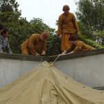 Days before the event sangha and friends erect the marquee over the cloister.